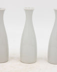 Collection of Three White Single Bud Vases, French Early 21st C.