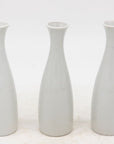 Collection of Three White Single Bud Vases, French Early 21st C.