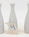 Collection of Three White Single Bud Vases, French Early 21st C.