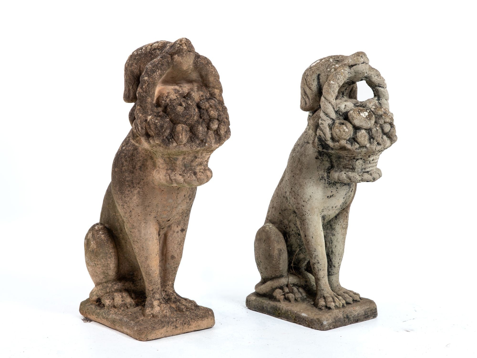 Matched Pair of Composite Stone Dogs with Fruit Baskets, England Mid 20th C.