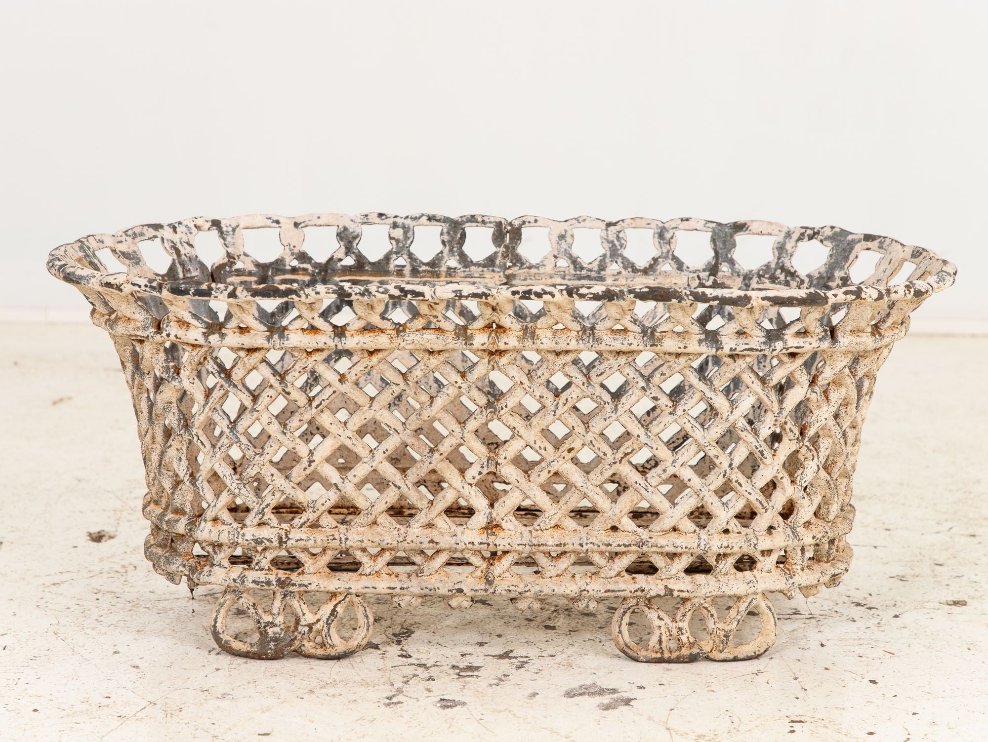 White Painted Cast Iron Latticework Basket, French early 20th C.