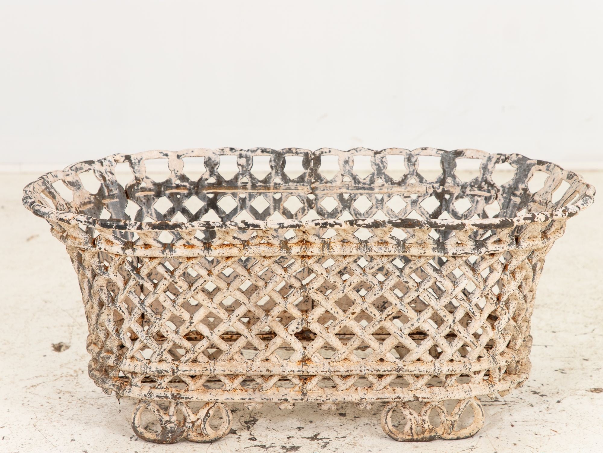 White Painted Cast Iron Latticework Basket, French early 20th C.