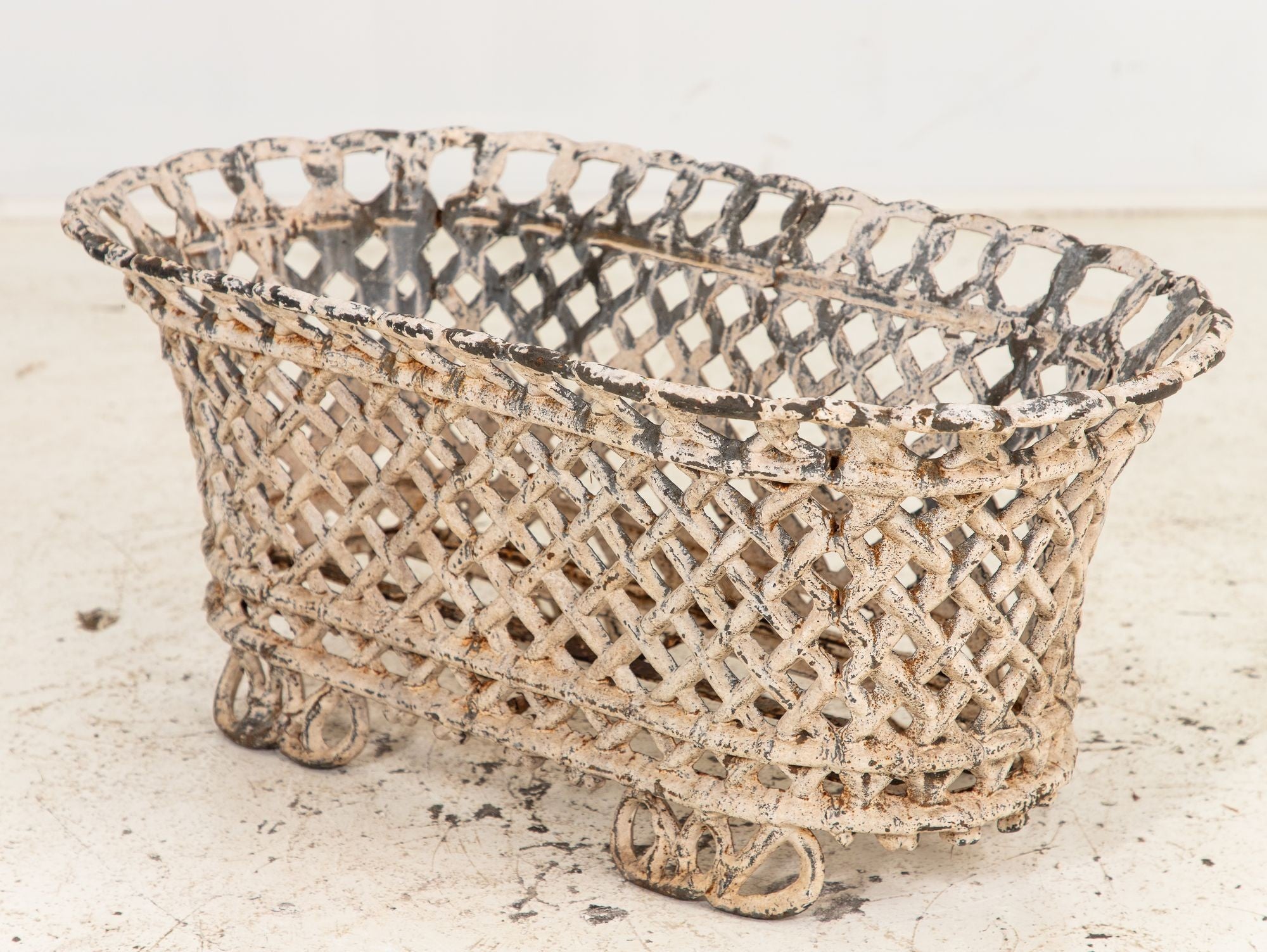White Painted Cast Iron Latticework Basket, French early 20th C.