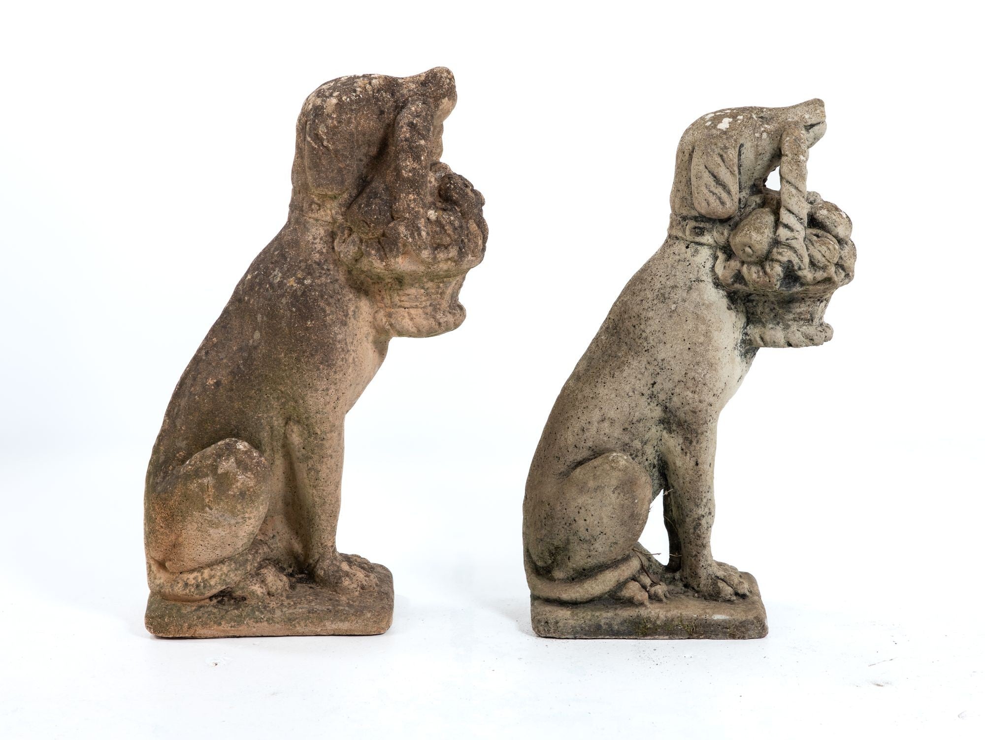 Matched Pair of Composite Stone Dogs with Fruit Baskets, England Mid 20th C.