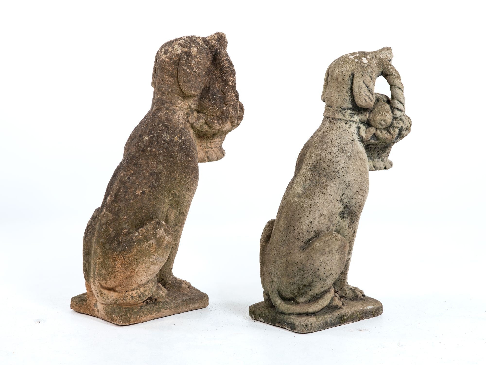 Matched Pair of Composite Stone Dogs with Fruit Baskets, England Mid 20th C.