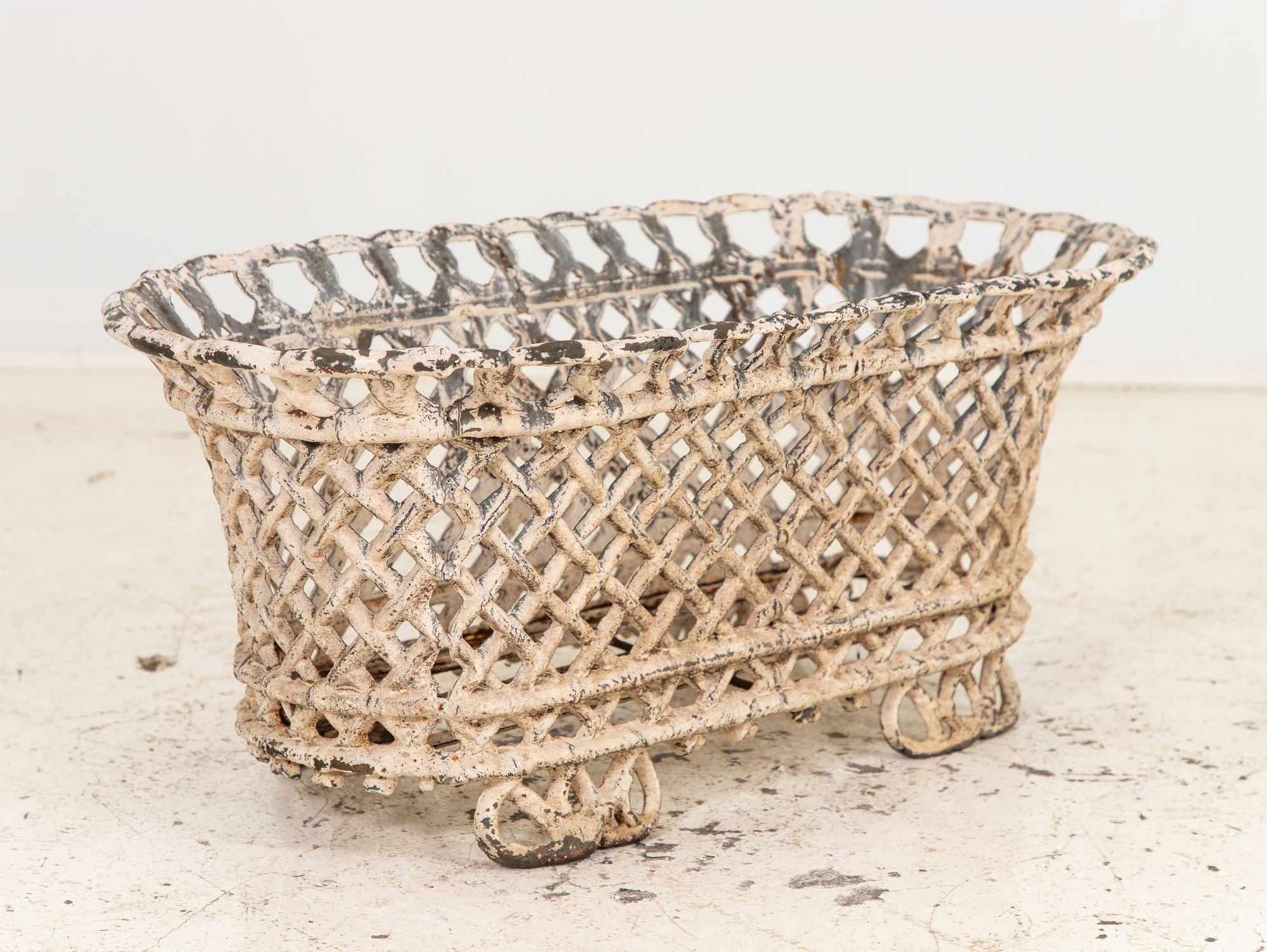 White Painted Cast Iron Latticework Basket, French early 20th C.
