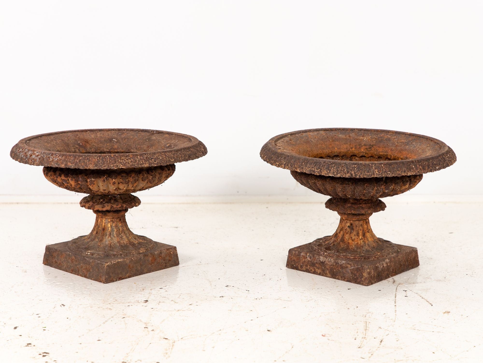 Pair of Neoclassical Cast Iron Urns, French early 20th C.